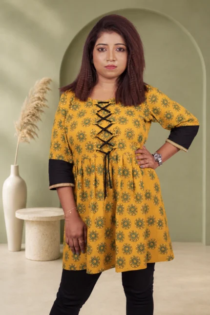 Women's mustard yellow Bagru block print A-line kurti with black lace-up front and contrast sleeves — main product image