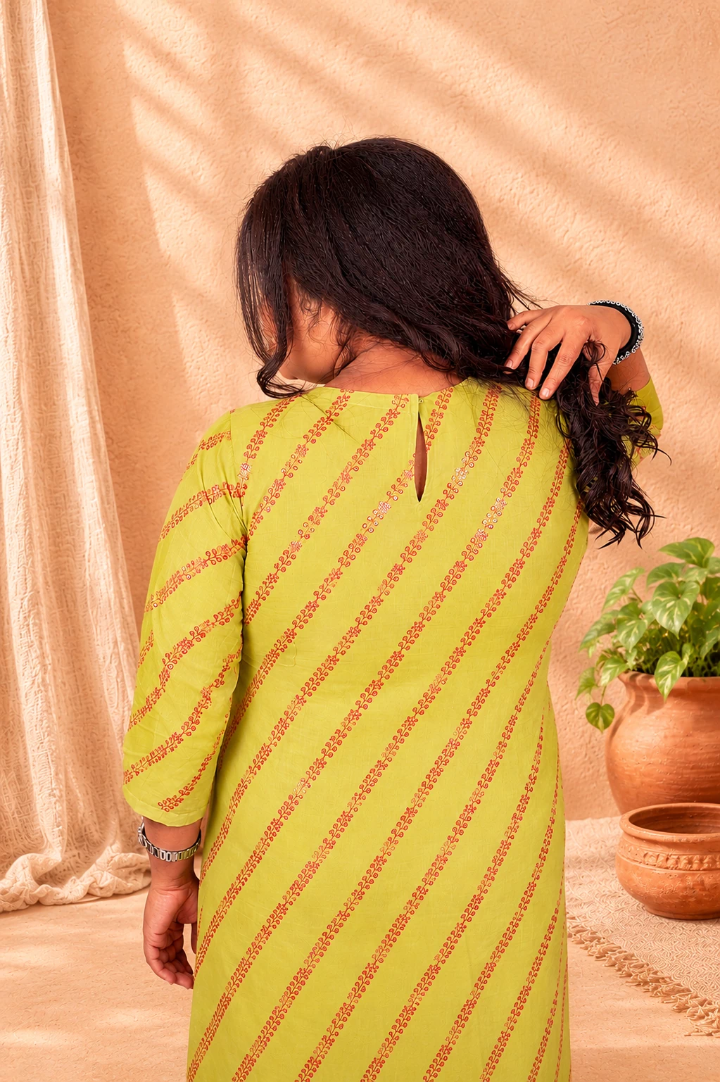 Close-up of lime green kurti back neckline with keyhole button detail