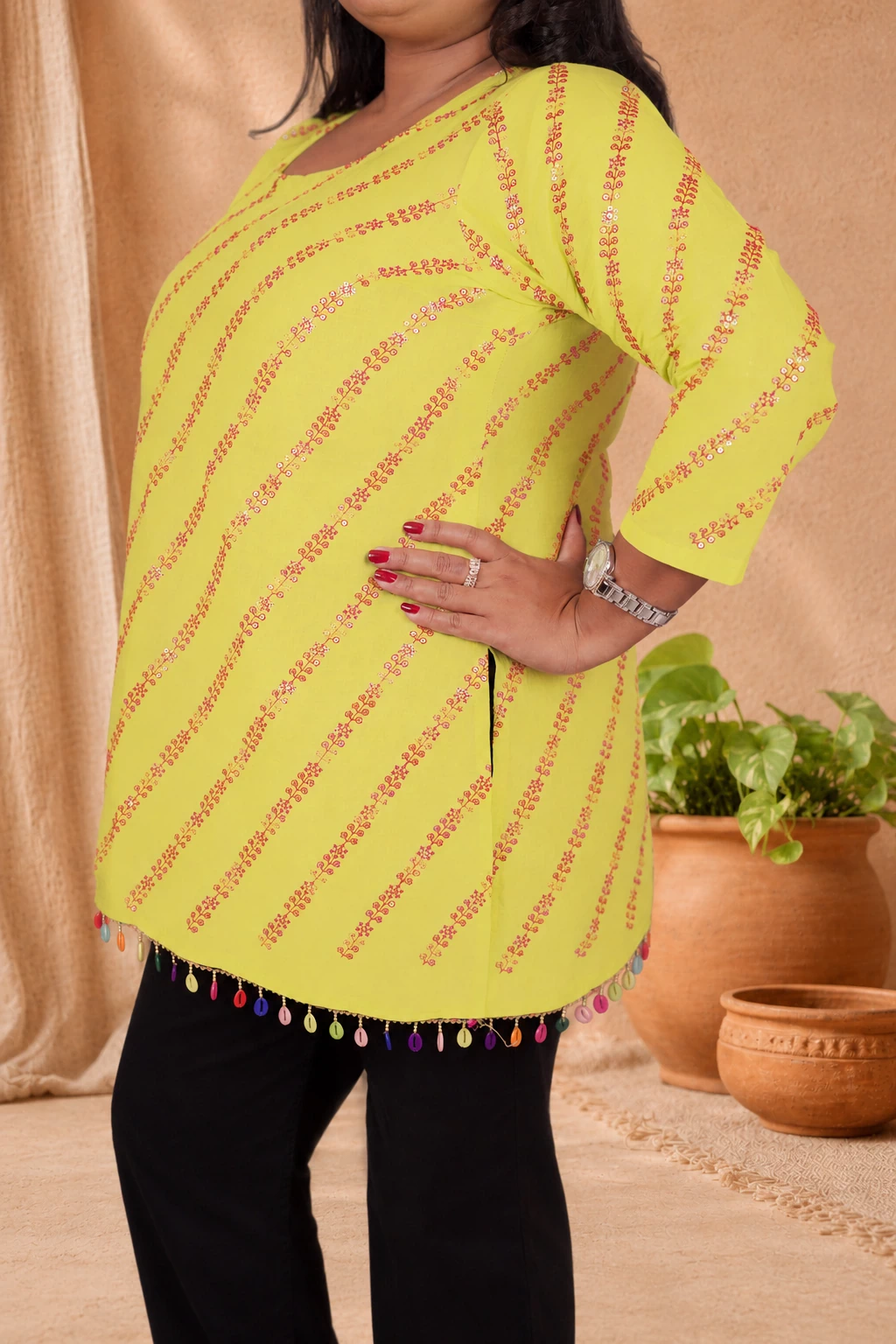 Side view of lime green cotton kurti showing side slit and sequin stripe design
