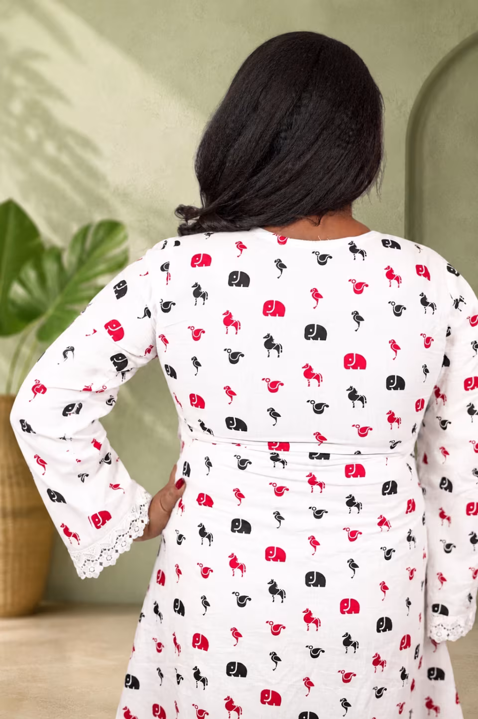 Back view close-up showing elephant and flamingo print with lace sleeve on cotton kurti