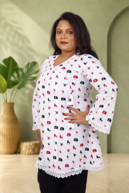 Side view of white cotton kurti showing angrakha style wrap front and lace sleeve trim
