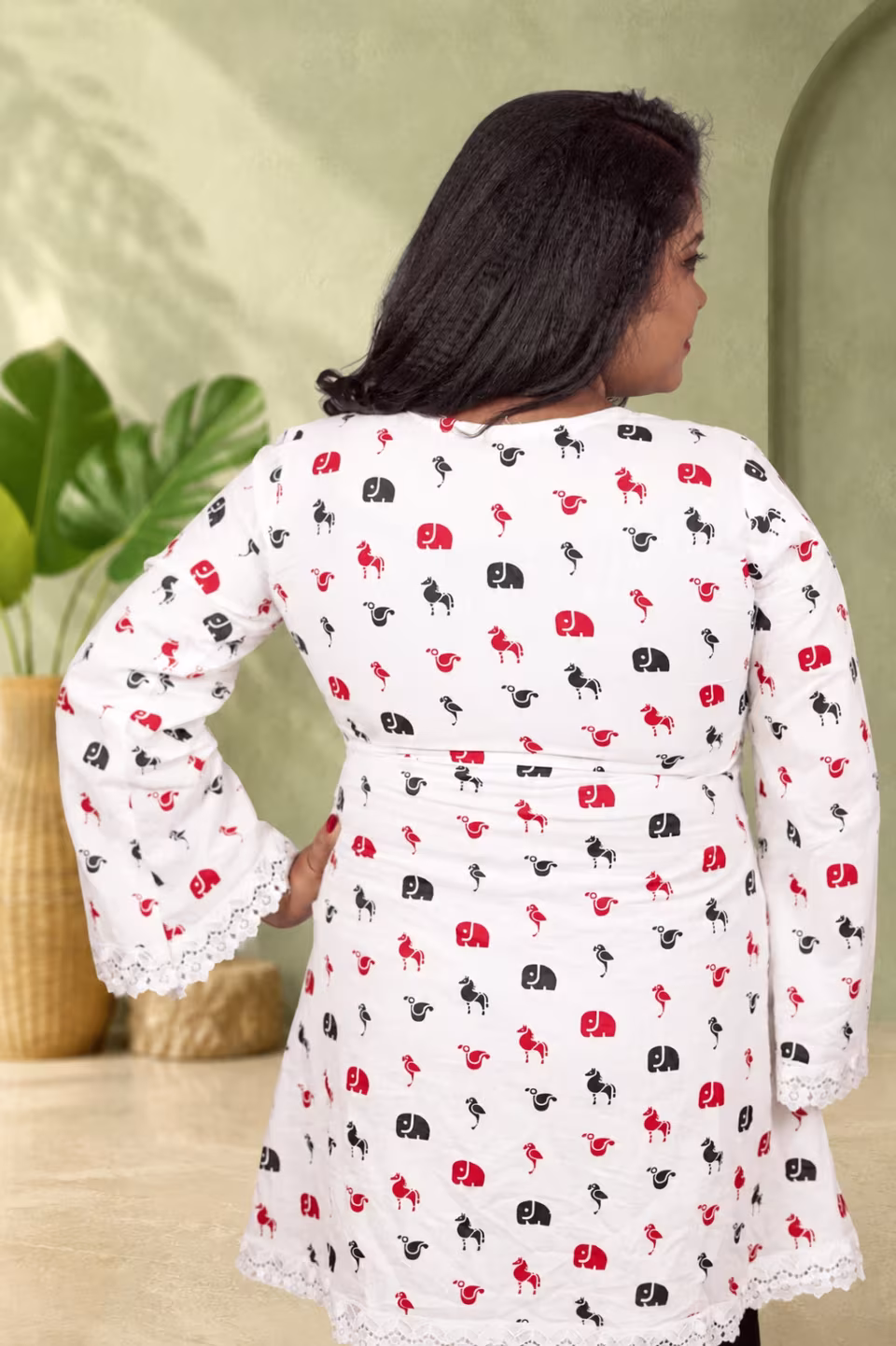 Full back view of white elephant print cotton kurti with lace hem for women